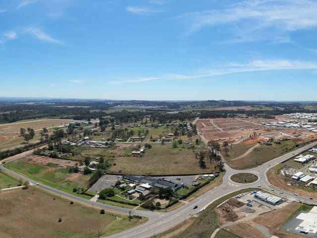 Housing streets, open fields, roads and cleared ground.