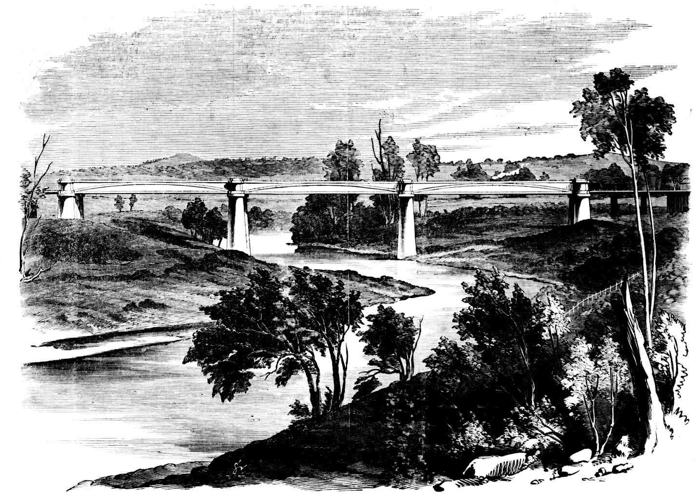 An engraving of a long iron railway bridge on stone piers crossing a river, with wooded banks on both sides.